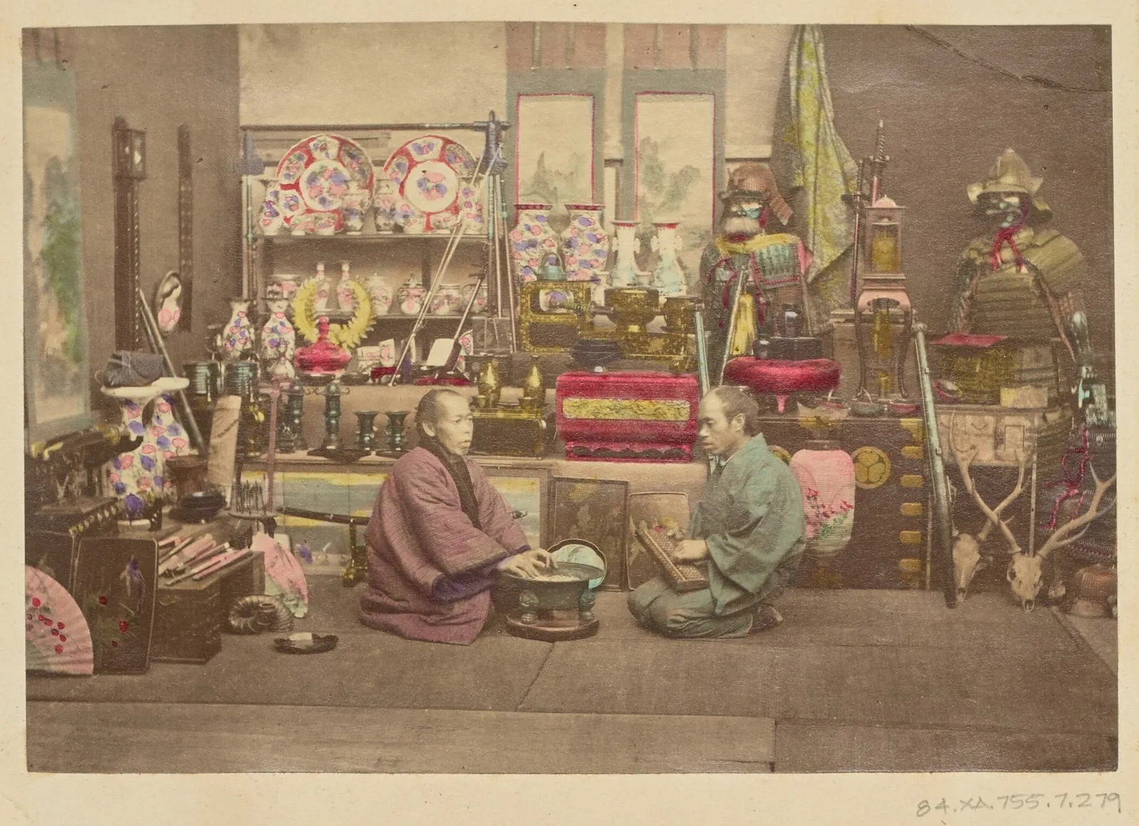 [Two Japanese business men in their shop]